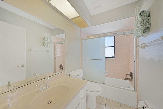 full bathroom featuring tile patterned flooring, enclosed tub / shower combo, vanity, and toilet