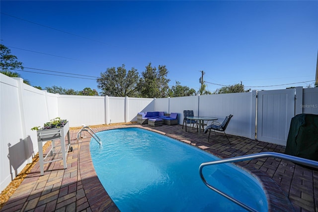 view of swimming pool featuring a patio and an outdoor hangout area