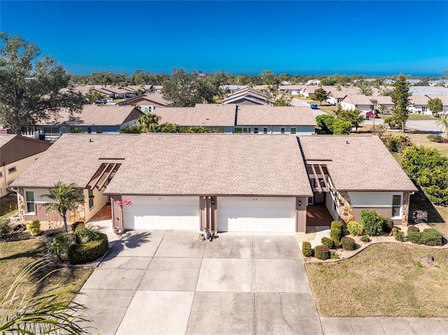 view of front of property with a garage and a front yard