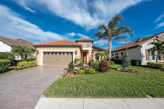 mediterranean / spanish-style home with a garage and a front lawn