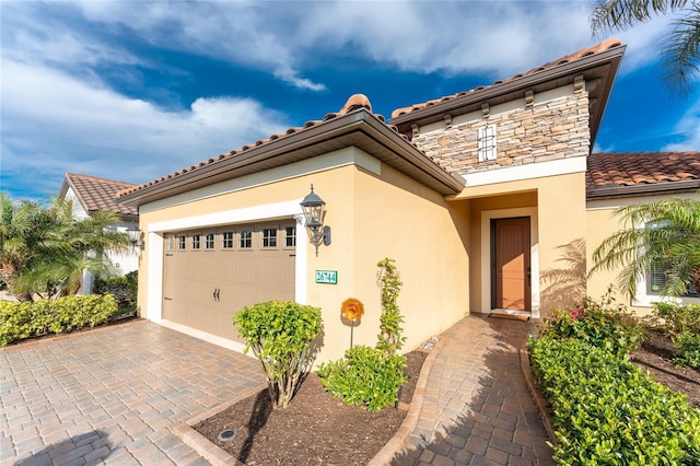 mediterranean / spanish home featuring a garage