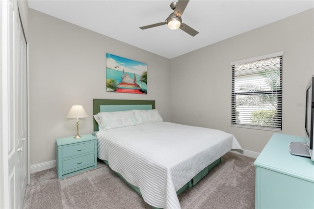 bedroom with light colored carpet and ceiling fan