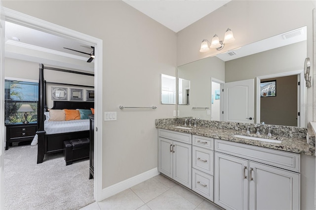 bathroom with tile patterned flooring and vanity