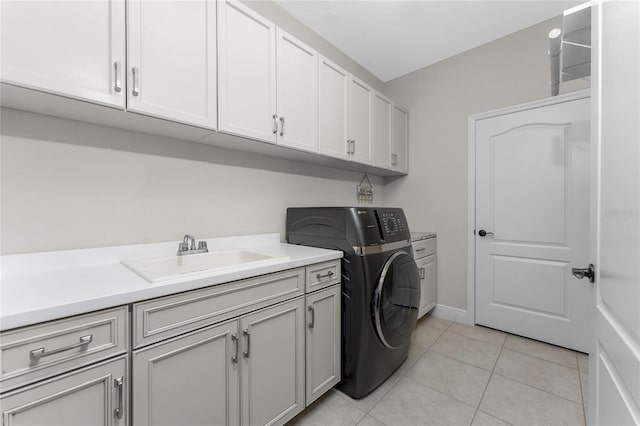 washroom featuring cabinets, washer / dryer, sink, and light tile patterned floors