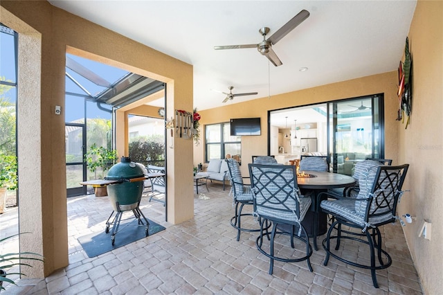 dining room with plenty of natural light and ceiling fan