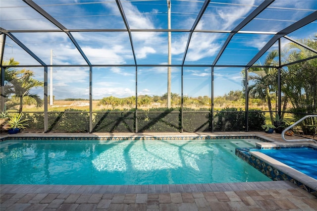 view of pool with a lanai and a patio area