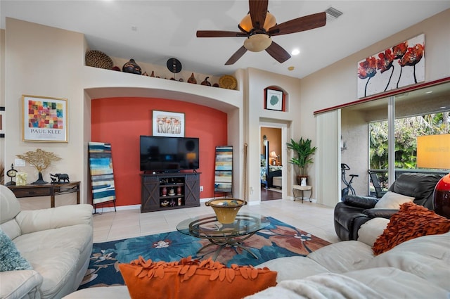 tiled living room featuring ceiling fan