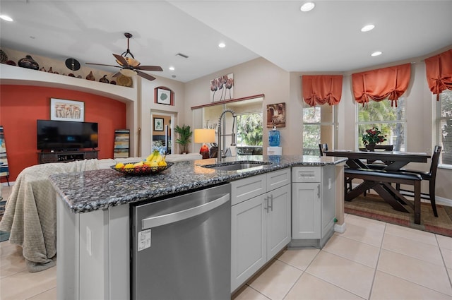 kitchen with sink, white cabinetry, a center island with sink, light tile patterned floors, and dishwasher