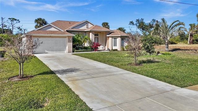 411 Boundary Blvd, Rotonda West, FL 33947 - view of front facade featuring concrete driveway, stucco siding, a front lawn, and an attached garage