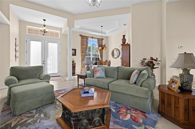 411 Boundary Blvd, Rotonda West, FL 33947 - living room with ornate columns, a chandelier, and french doors