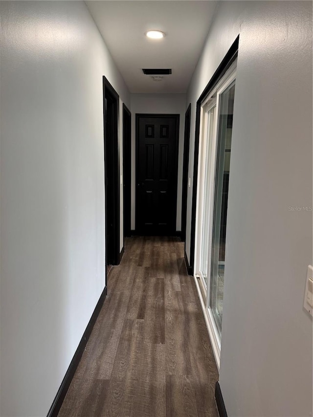 hallway featuring dark hardwood / wood-style floors