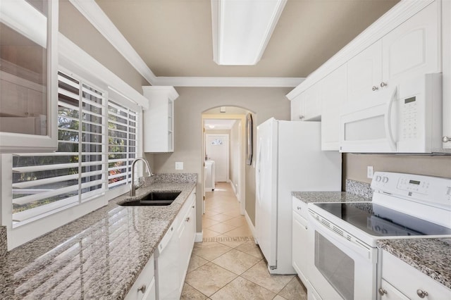 kitchen with white cabinetry, sink, ornamental molding, light tile patterned floors, and white appliances