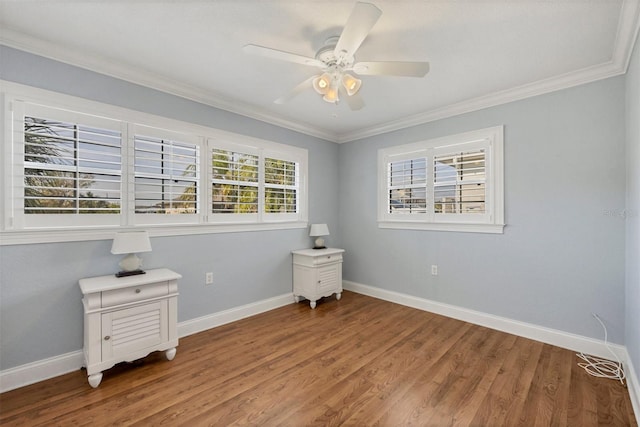 bedroom with hardwood / wood-style flooring, ornamental molding, and ceiling fan