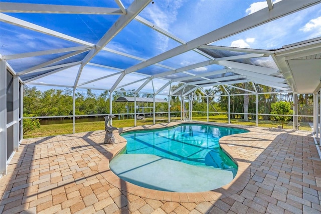 view of swimming pool featuring a lanai and a patio