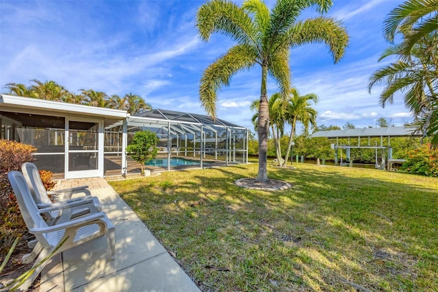 view of yard featuring a lanai and a sunroom