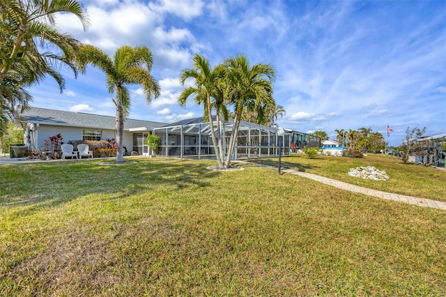 view of yard with a lanai