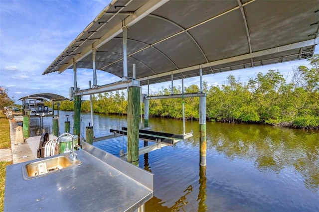 dock area featuring a water view