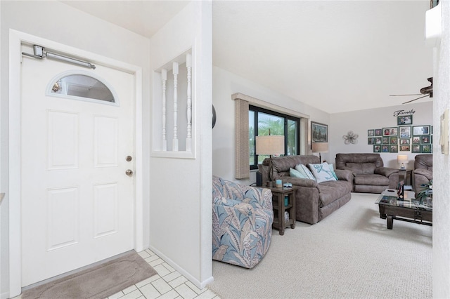 interior space with light carpet and ceiling fan