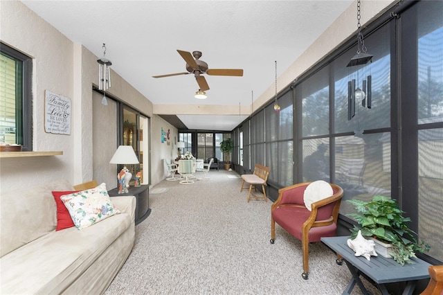 sunroom with ceiling fan