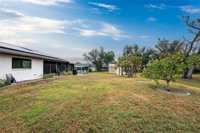 view of yard with a sunroom