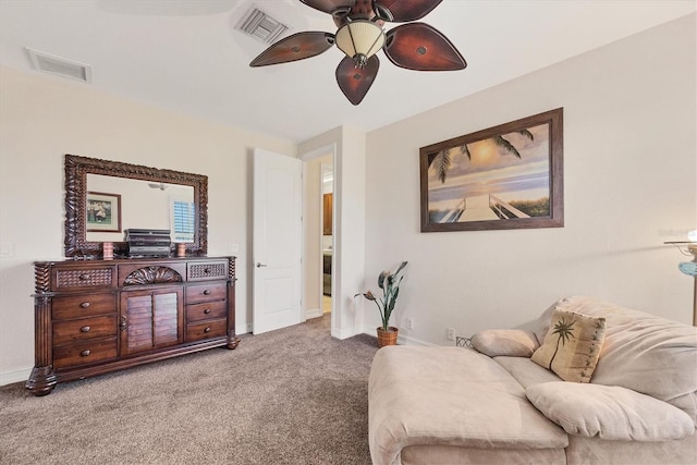 sitting room with baseboards, visible vents, ceiling fan, and carpet flooring