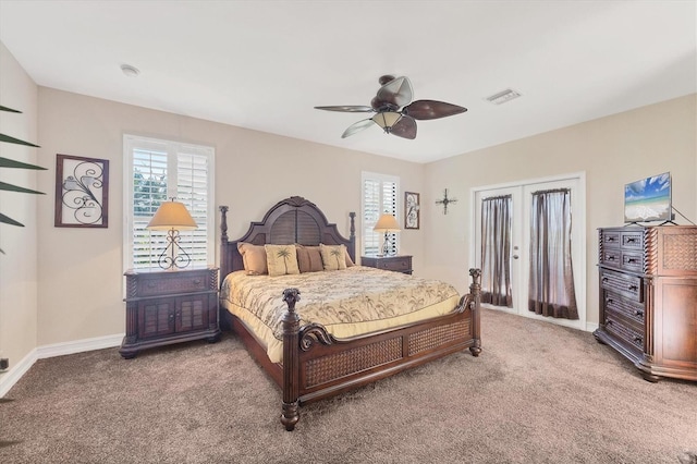 bedroom with carpet floors, multiple windows, visible vents, and a ceiling fan