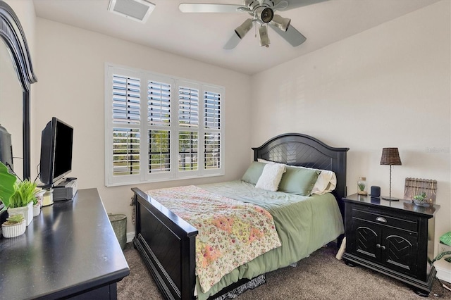 bedroom with ceiling fan, dark colored carpet, and visible vents