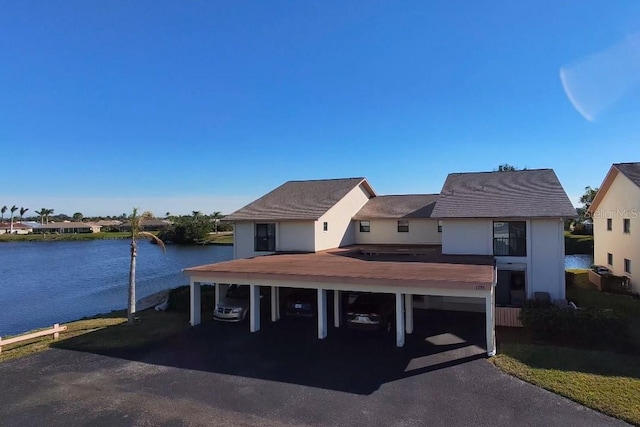 view of front of house with a water view