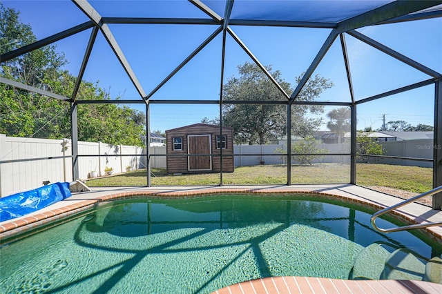 view of swimming pool with a lanai, a shed, and a lawn