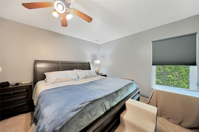 bedroom featuring ceiling fan and light tile patterned floors