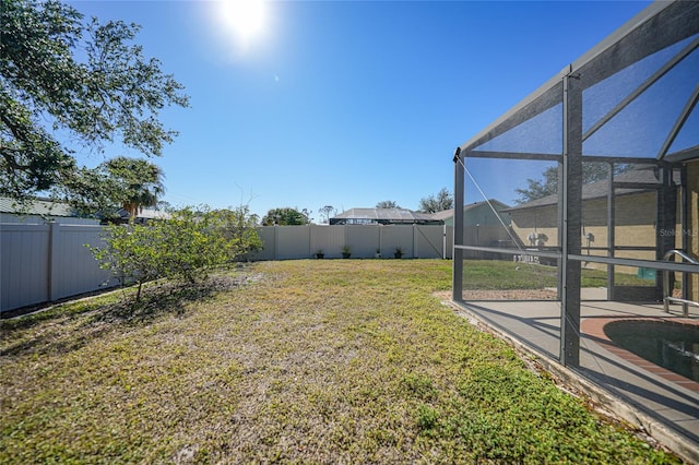 view of yard featuring a lanai and a patio area