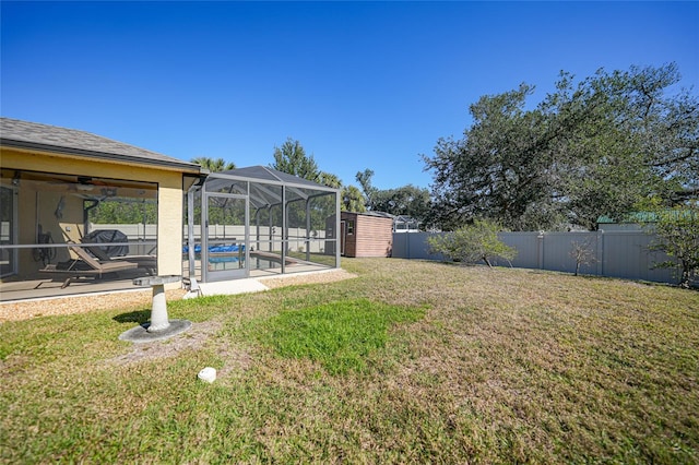 view of yard with a fenced in pool and a lanai