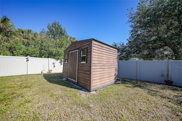 view of outdoor structure with a lawn