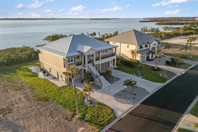 birds eye view of property with a water view