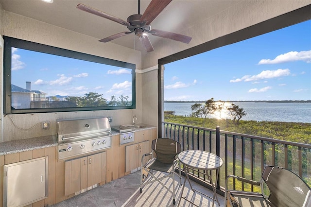 view of patio with area for grilling, sink, and ceiling fan