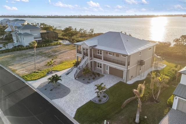 birds eye view of property with a water view