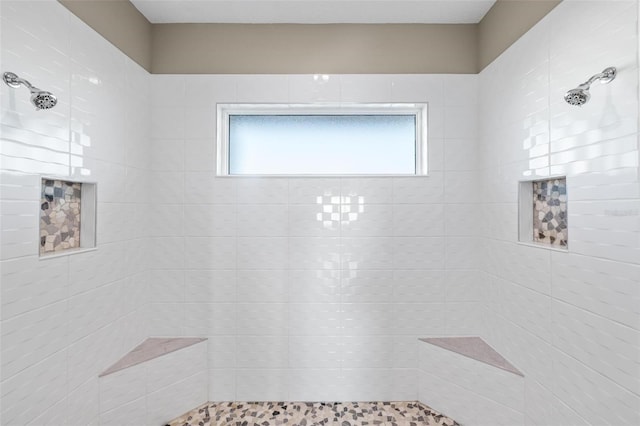 bathroom with tiled shower