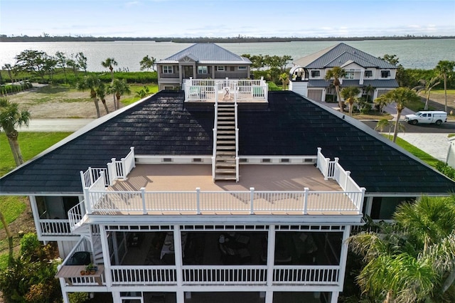 back of house featuring a water view