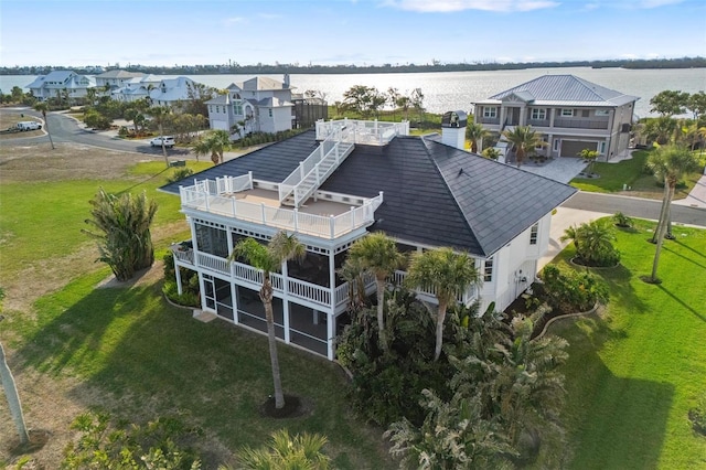 drone / aerial view with a water view