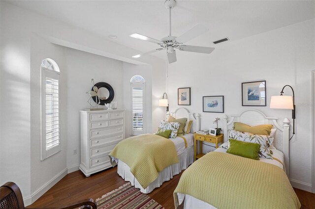 bedroom with dark wood-type flooring and ceiling fan