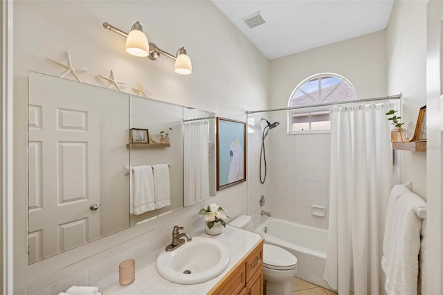 full bathroom featuring vanity, toilet, and shower / bath combo