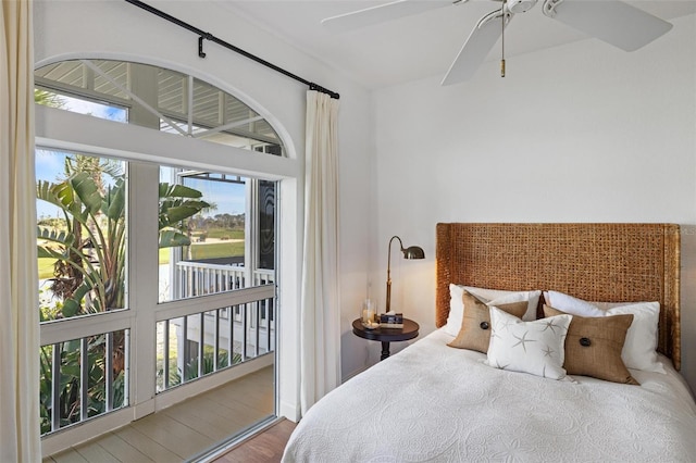 bedroom featuring hardwood / wood-style floors, access to outside, and ceiling fan