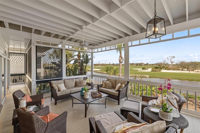 sunroom / solarium featuring beam ceiling