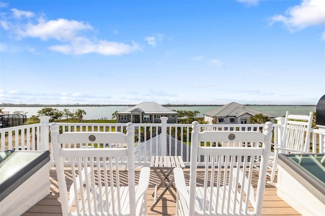 wooden terrace with a water view