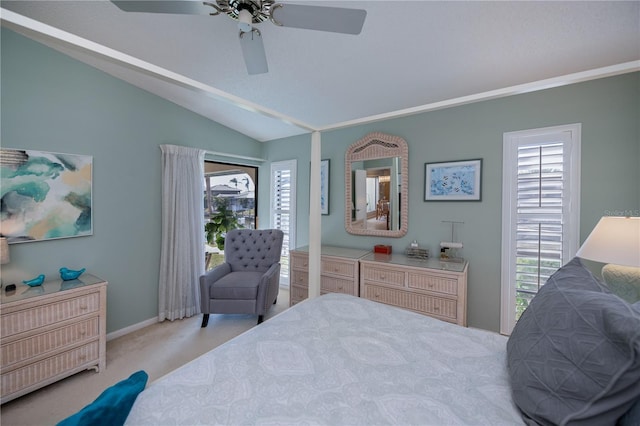 carpeted bedroom with multiple windows, lofted ceiling, and ceiling fan