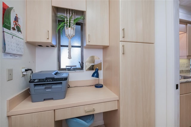 kitchen featuring light brown cabinets