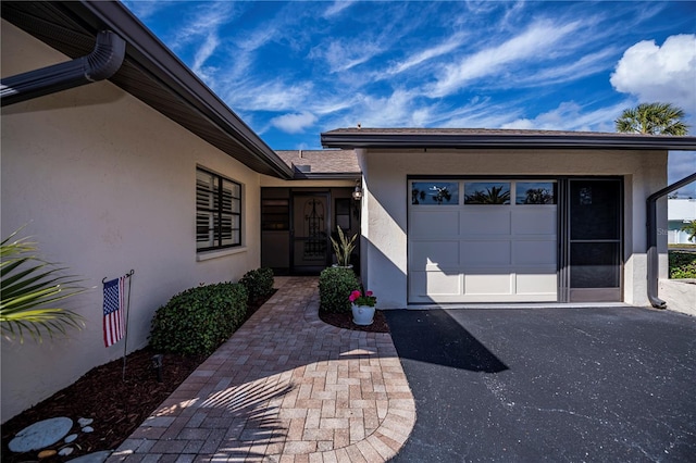 entrance to property featuring a garage