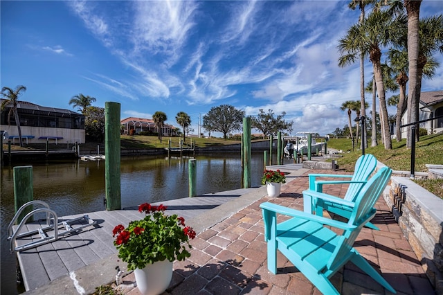 view of patio featuring a dock and a water view