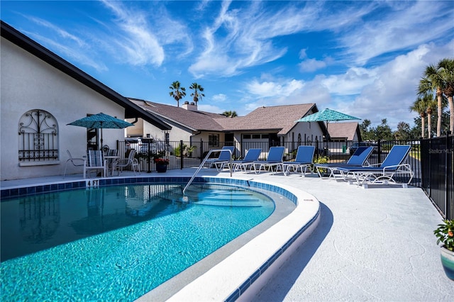 view of swimming pool featuring a patio