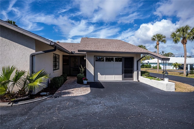 ranch-style home featuring a garage